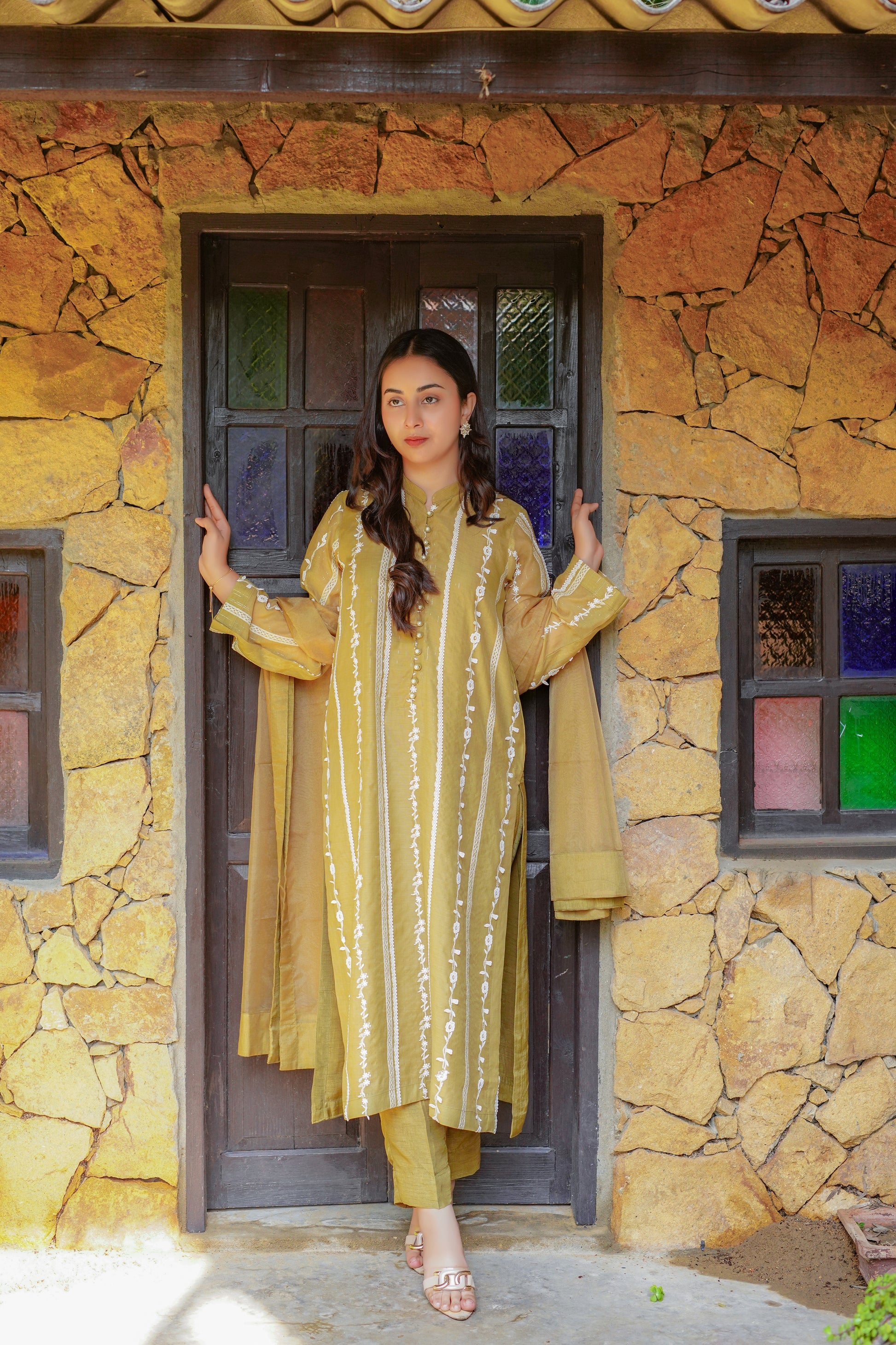 Chic mustard-yellow embroidered dress for women – stylish and modest outfit with vertical patterns, paired with matching pants and dupatta. Perfect for casual, formal, and festive wear. Shop modern modest clothing online.