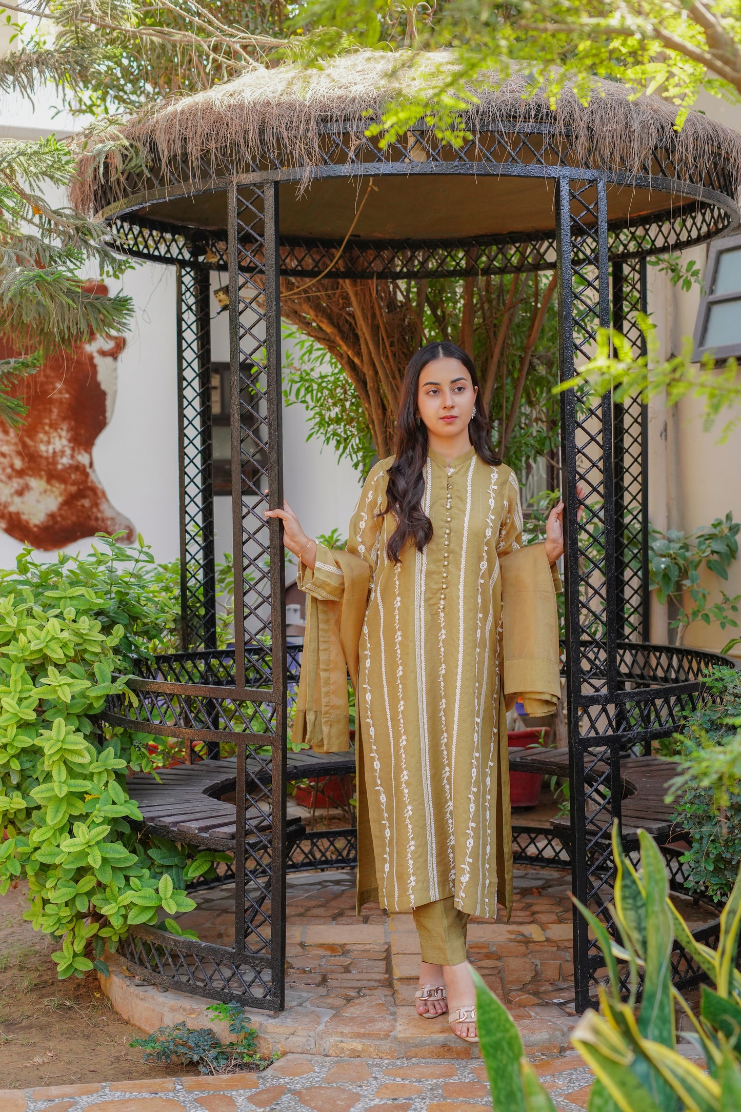 Chic mustard-yellow embroidered dress for women – stylish and modest outfit with vertical patterns, paired with matching pants and dupatta. Perfect for casual, formal, and festive wear. Shop modern modest clothing online.