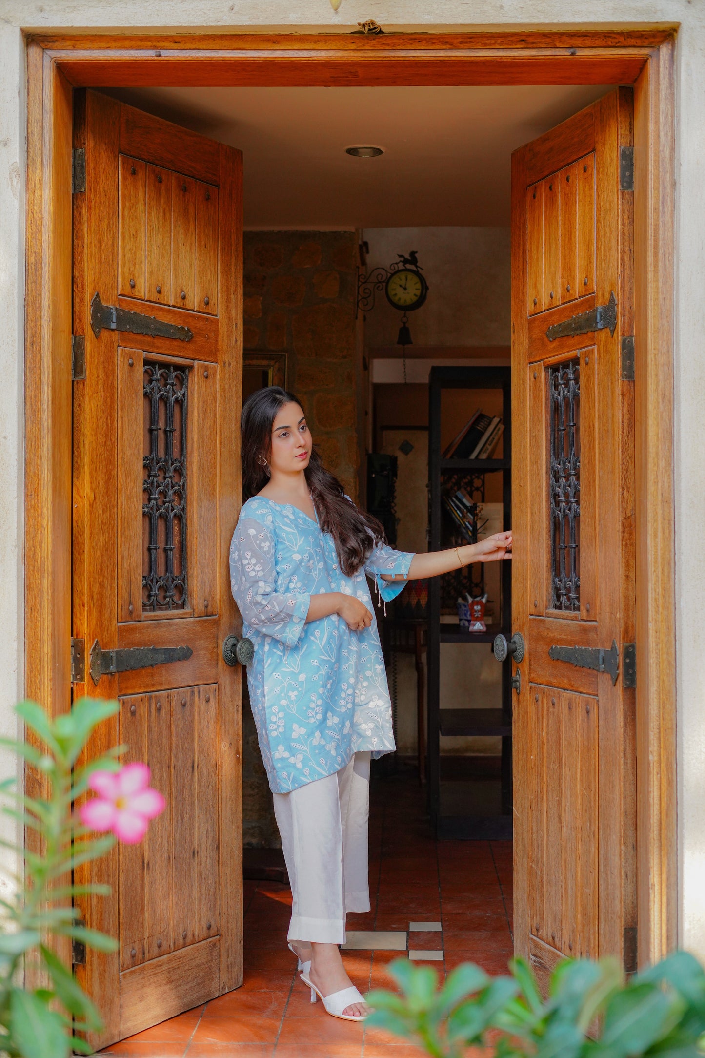 Light blue embroidered tunic with floral patterns for women – paired with cream-colored pants and heels. Perfect for casual and semi-formal occasions. Shop elegant and modest women's clothing online.