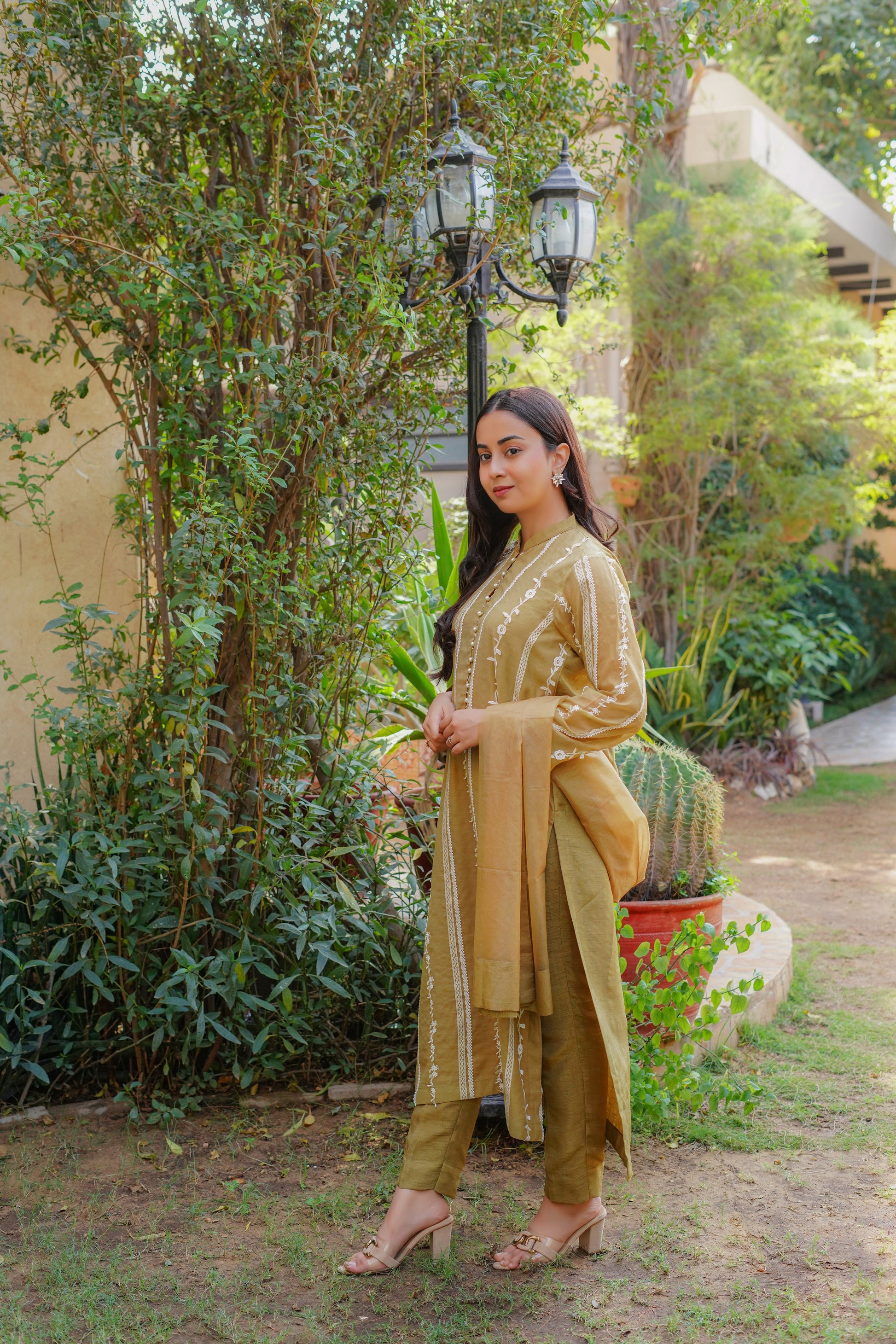 Chic mustard-yellow embroidered dress for women – stylish and modest outfit with vertical patterns, paired with matching pants and dupatta. Perfect for casual, formal, and festive wear. Shop modern modest clothing online.